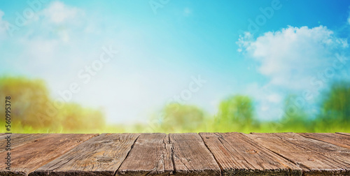 Wooden table and spring landscape background