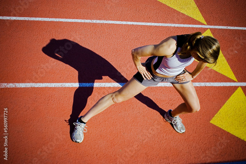 A distance runner stretches after a rigorous workout. photo