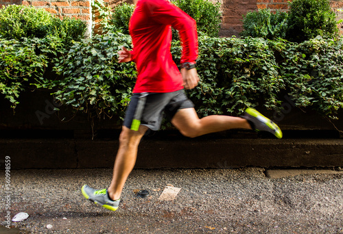 Runner jogging in street, Pioneer Square, Seattle, Washington State, USA photo