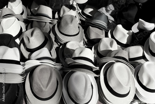 evocative black and white texture image of men's straw hats