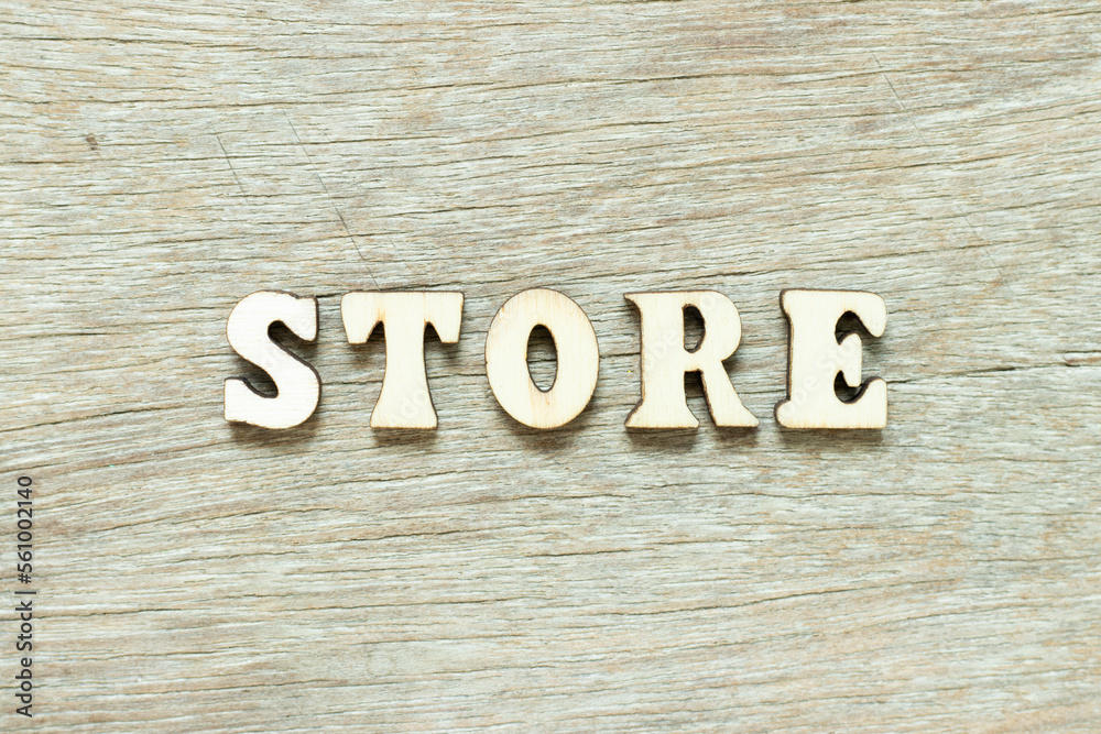 Alphabet letter in word store on wood background Alphabet letter in word store on wood background