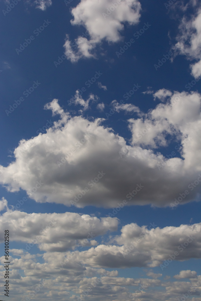 clouds in the sky lit by the sun on a summer day. background