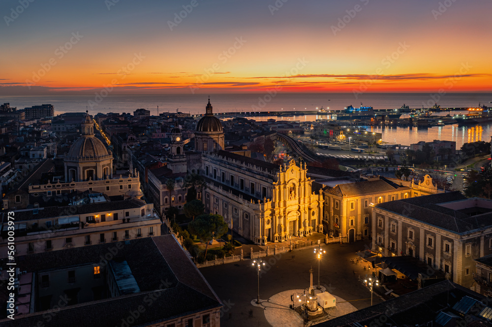 Aerial view of the Catania Saint Agatha's Cathedral by sunrise with Mount Etna in the background - Sicily, Italy