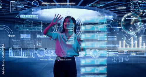 Female Scientist Exploring and Analyzing a Digital Data, Touching an Invisible Holographic Screen. Asian Woman, Business Reviews the Statistics and Moving Animated Virtual Graphs and Table Data. 