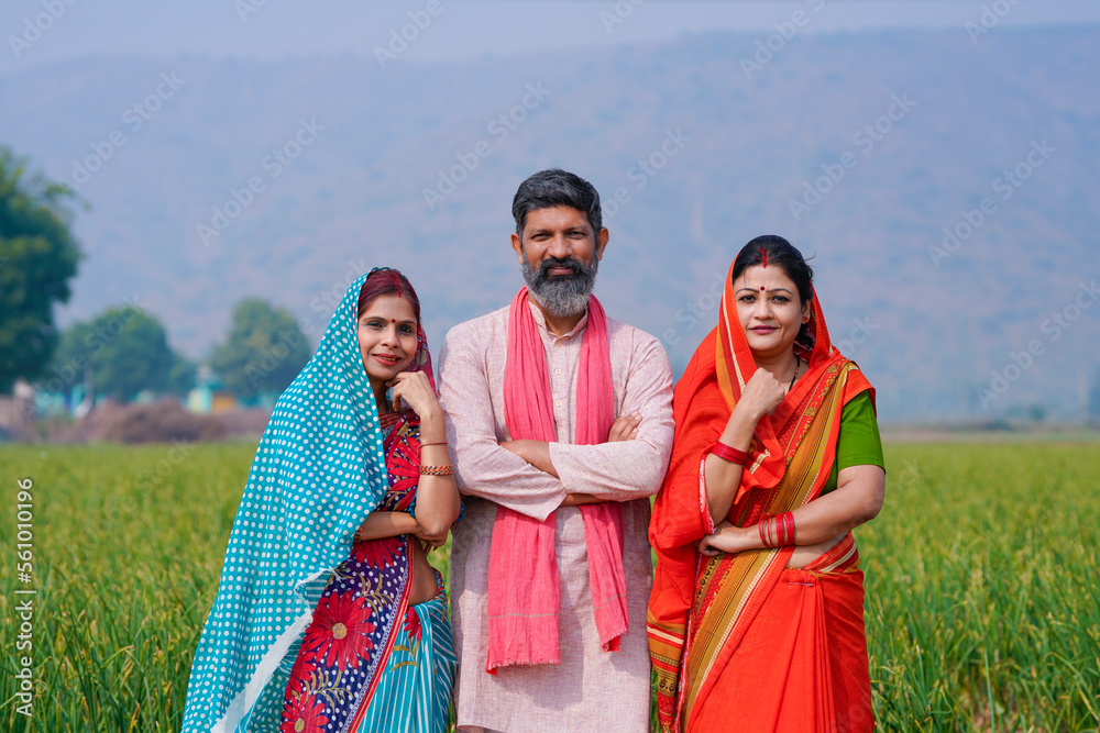 Indian rural people standing at agriculture field.