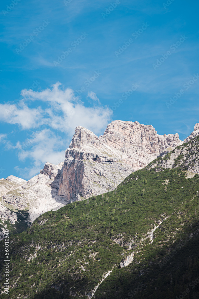 Amazing mountain cliffs viewed from Lago di Dobbiaco - The dolomites - Italy Amazing mountain cliffs viewed from Lago di Dobbiaco - The dolomites - Italy