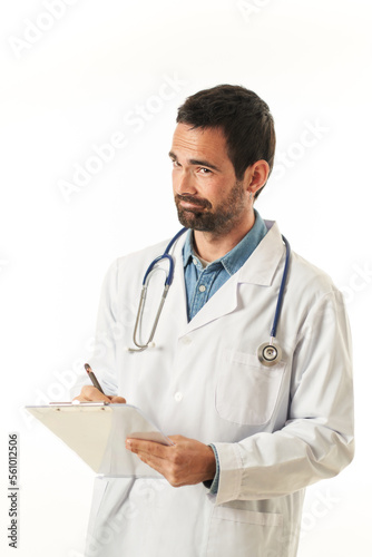 Portrait of a young male doctor with a folder with a worried gesture, isolated on white background