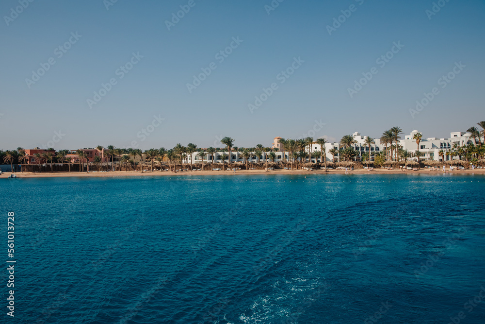 Beautiful hotel on the Red Sea beach in Egypt. Blue water and beautiful hotel area Beautiful hotel on the Red Sea beach in Egypt. Blue water and beautiful hotel area