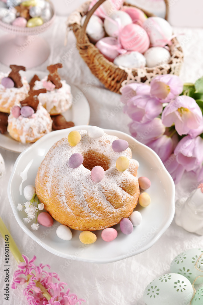 Sweet pastries on Easter table in pastel colors Sweet pastries on Easter table in pastel colors
