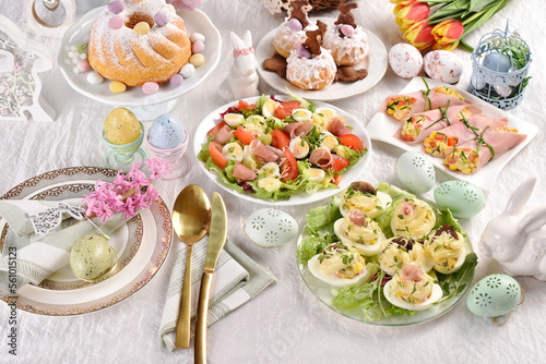 Easter table with appetizers and sweet pastries