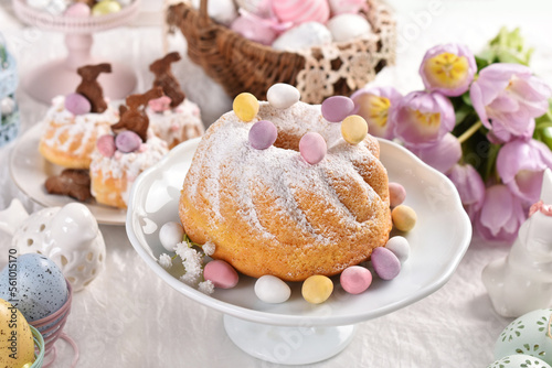 Sweet pastries on Easter table in pastel colors