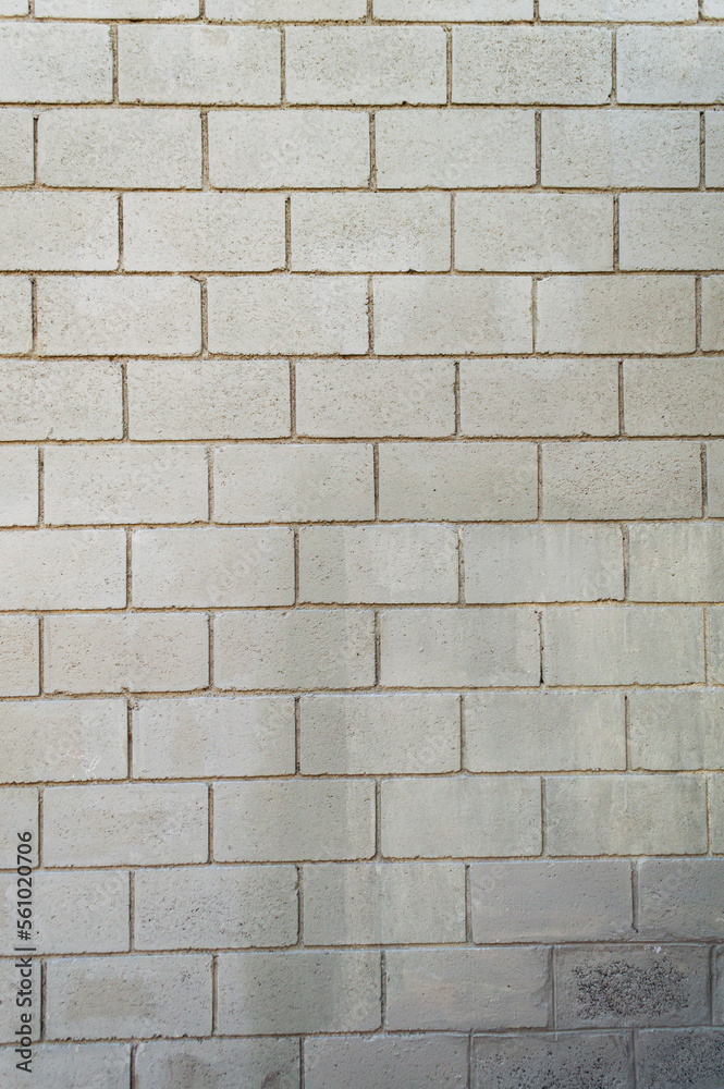 Wall made with gray bricks. Vertical image. Space for advertising. Wall made with gray bricks. Vertical image. Space for advertising.
