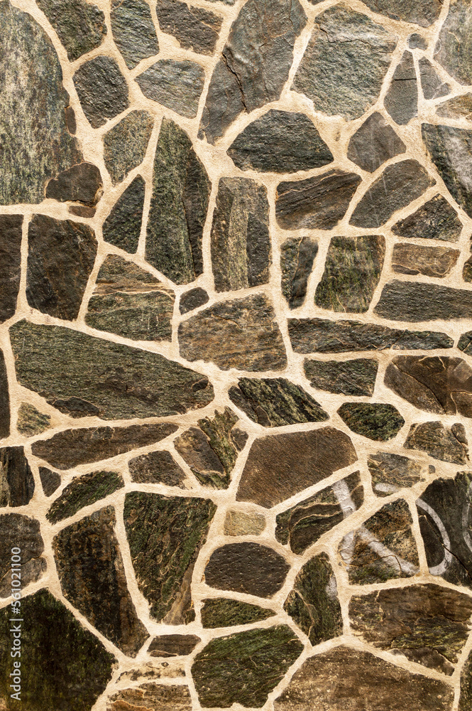 Wall of black cracked stones. Vertical image. Advertising space. Wall of black cracked stones. Vertical image. Advertising space.