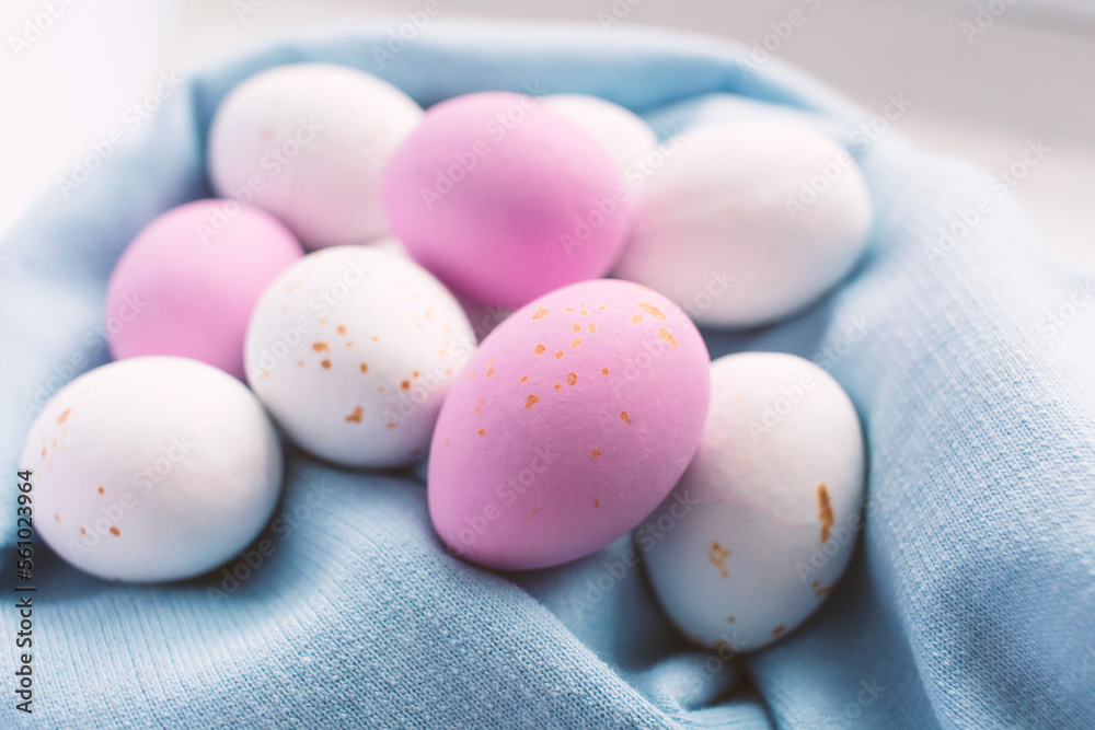 Colorful chocolate Easter eggs on blue background with copy space Colorful chocolate Easter eggs on blue background with copy space