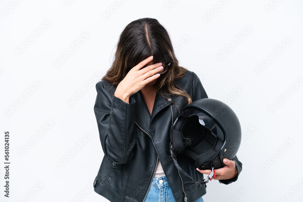 Young caucasian woman with a motorcycle helmet isolated on white background with tired and sick expression