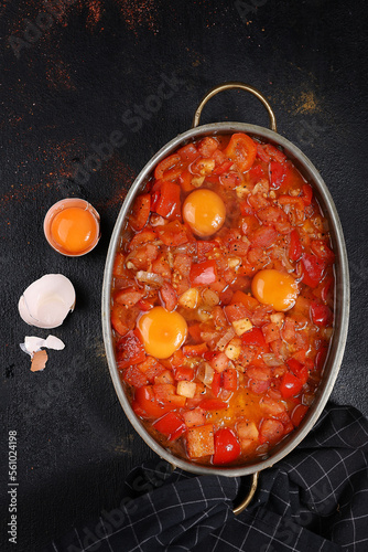 tomato sauce in a pan eggs