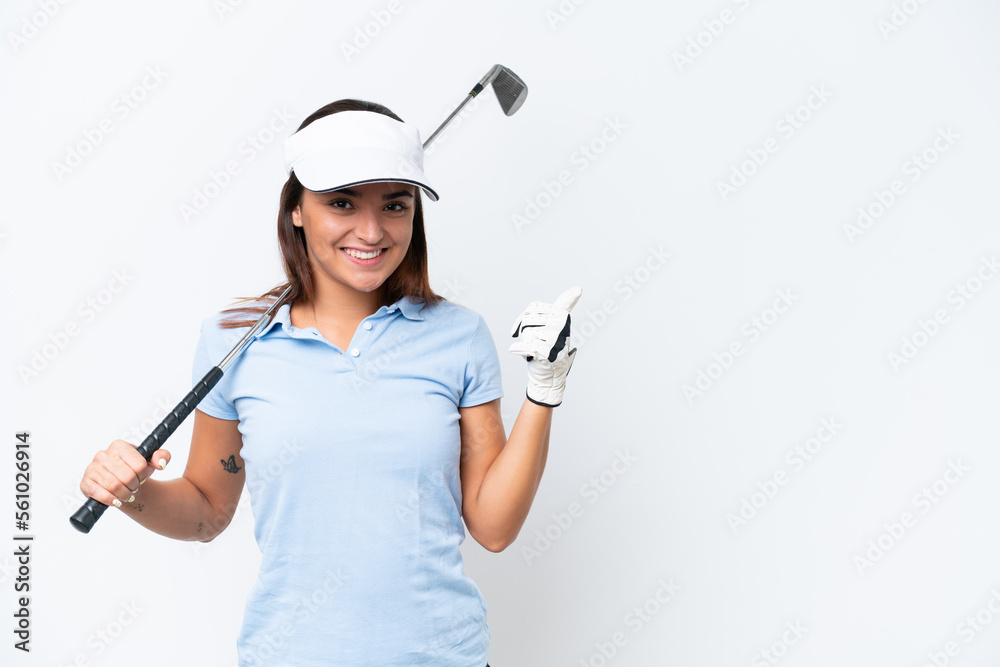 Young caucasian woman playing golf isolated on white background pointing to the side to present a product Young caucasian woman playing golf isolated on white background pointing to the side to present a product
