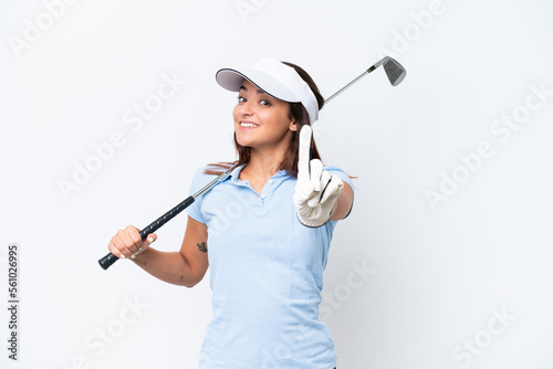 Young caucasian woman playing golf isolated on white background showing and lifting a finger