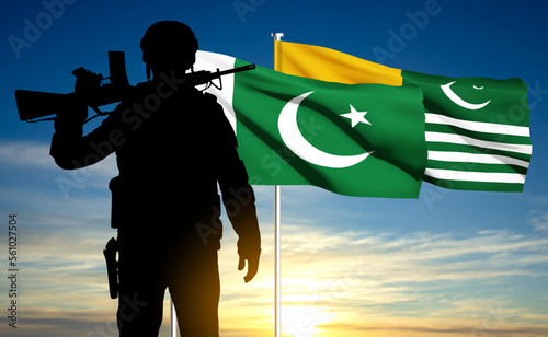 SIlhouette of soldier on background of sunset with Pakistan and Kashmir Flags. Patriotic background. EPS10 vector