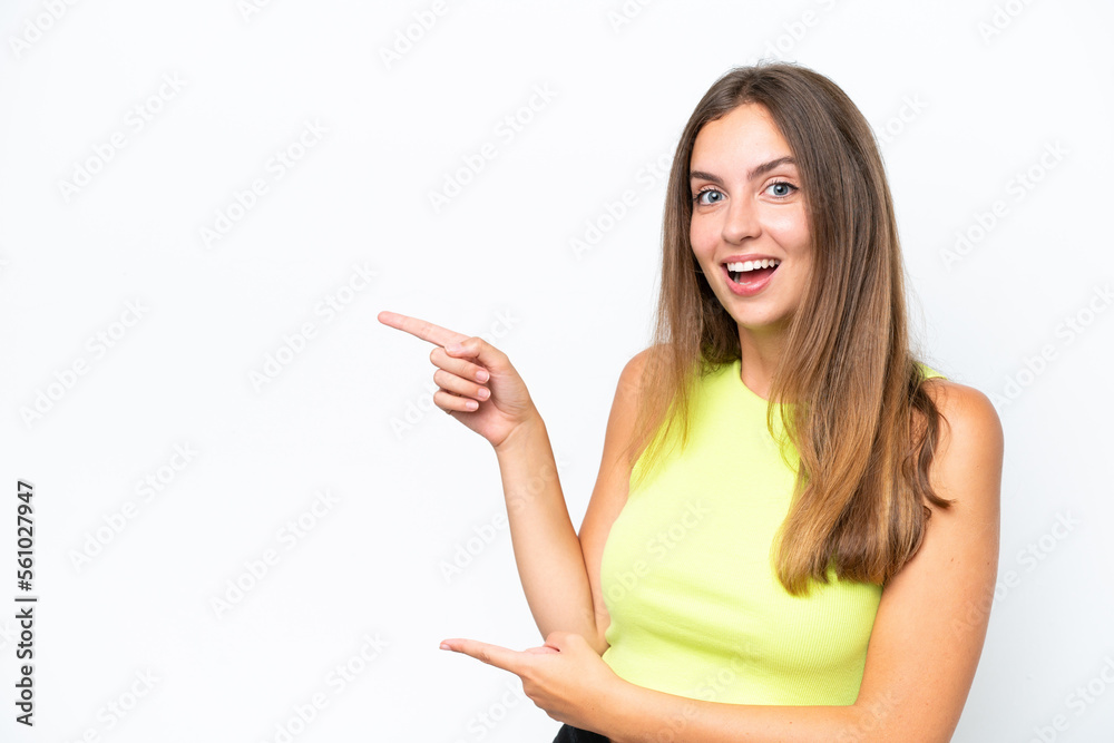 Young caucasian woman isolated on white background surprised and pointing side Young caucasian woman isolated on white background surprised and pointing side