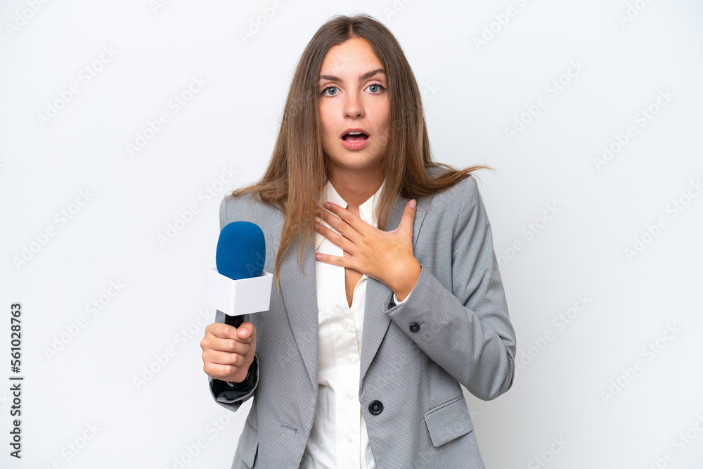 Young TV presenter caucasian woman isolated on white background surprised and shocked while looking right Young TV presenter caucasian woman isolated on white background surprised and shocked while looking right