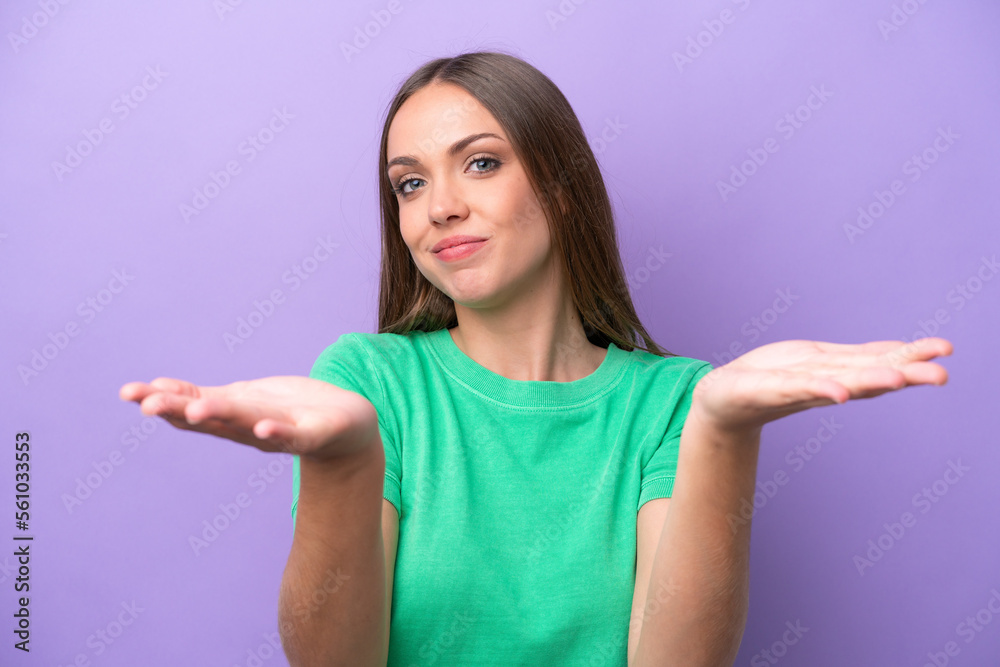 Young caucasian woman isolated on purple background having doubts Young caucasian woman isolated on purple background having doubts
