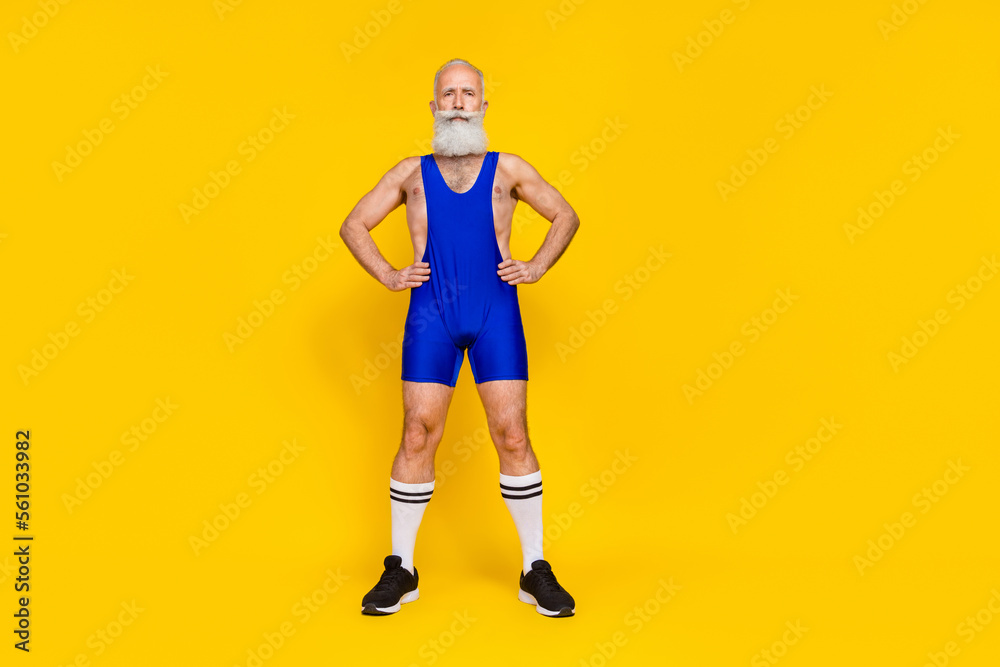 Full length photo of muscular sporty strong pensioner macho champion cross cardio aerobics challenge isolated on yellow color background