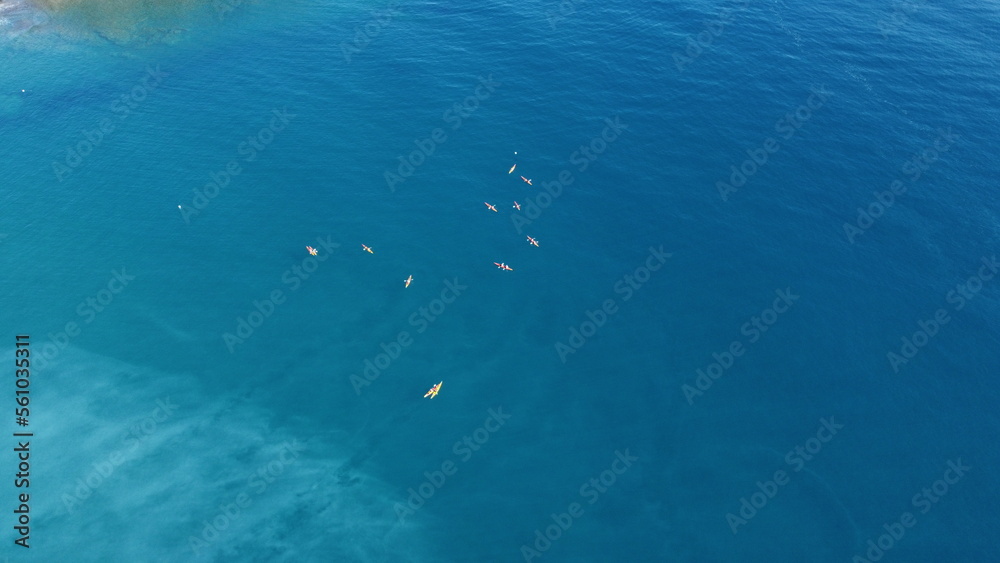 Naklejka premium Several kayakers in the mediterranean from a drone