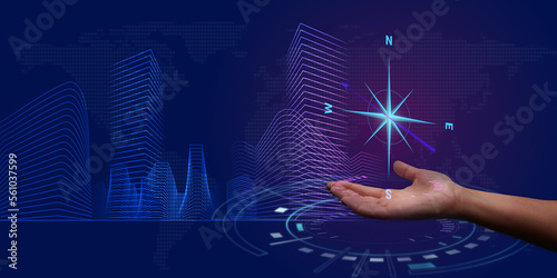 Foto Compass symbol over a woman's hand on an abstract graphic city background