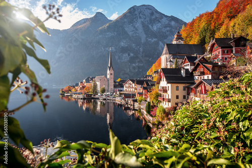 Impressive view of famous old town Hallstatt, Salzkammergut, Austria. Scenic golden morning light on a beautiful sunny day at sunrise in summer. Concept ideal resting place. Popular travel destination photo