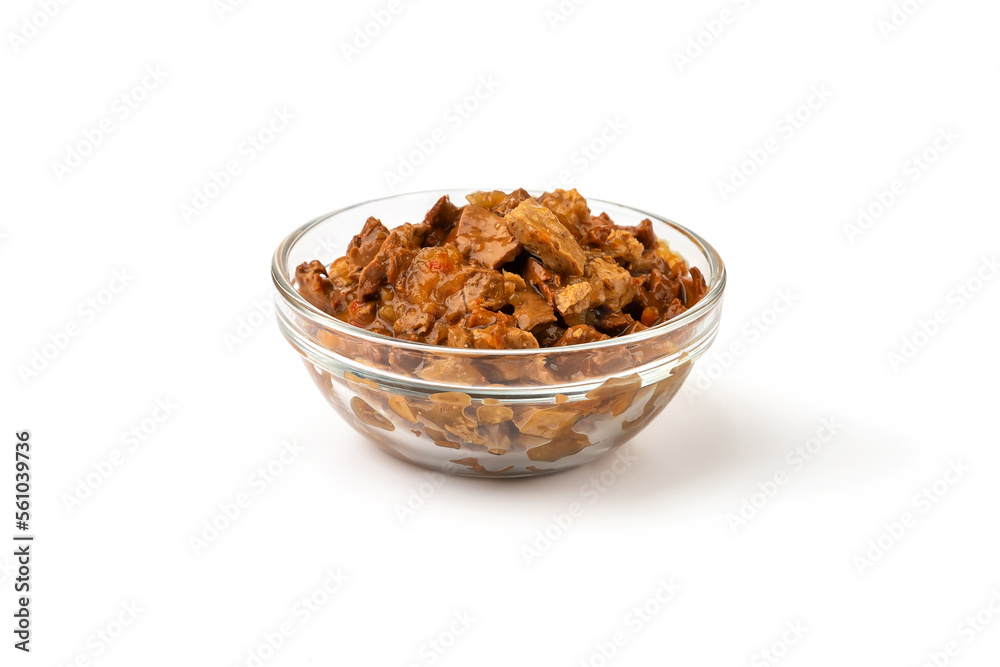 Wet food for cats and dogs in a transparent bowl on a white background. Wet food for cats and dogs in a transparent bowl on a white background.
