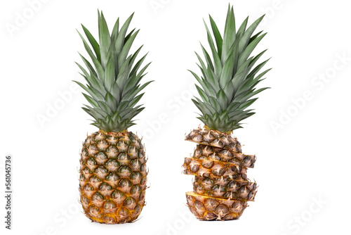 Two fresh juicy pineapples with different shapes. Sliced and whole. Isolated