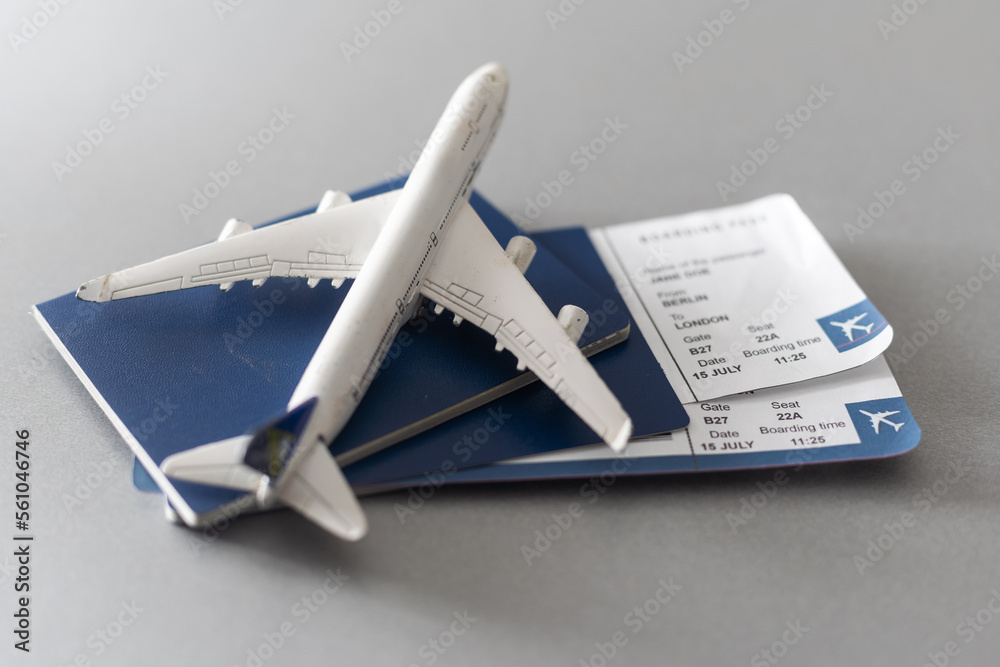 Fototapeta premium Airline tickets and documents on wooden table, top view