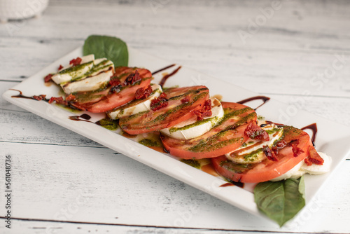 Obraz na płótnie Caprese Salad on a white wooden table w salonie