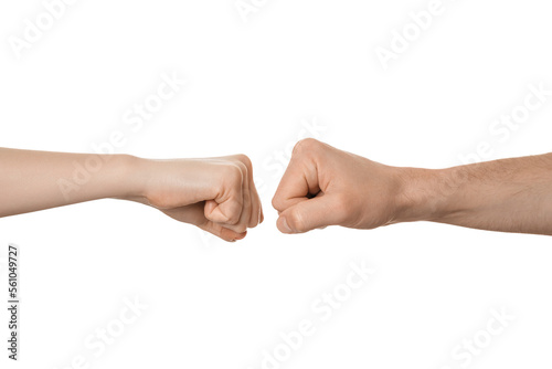 Man's and woman's fists near each other, about to fist bump. Fight, clash, conflict concept.