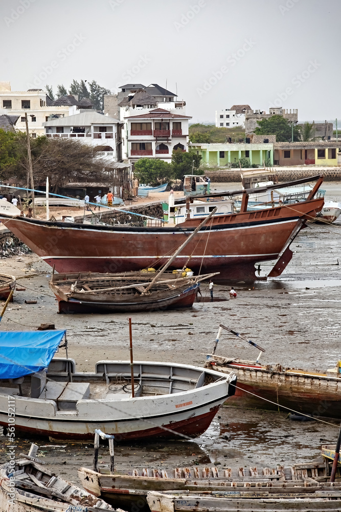 Local fishermen and fishing boats in Lamu island, Kenya