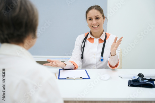 Pleasant doctor leads a reception in a medical clinic