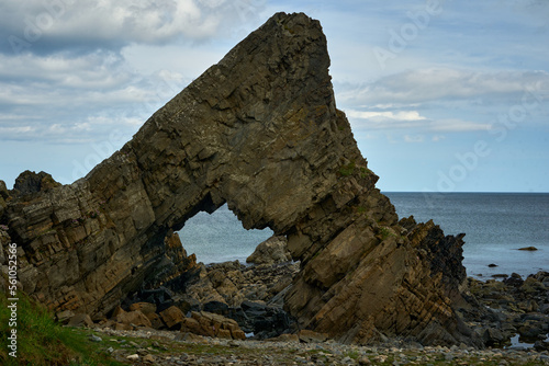 A bizarre rock with a hole on a seaside