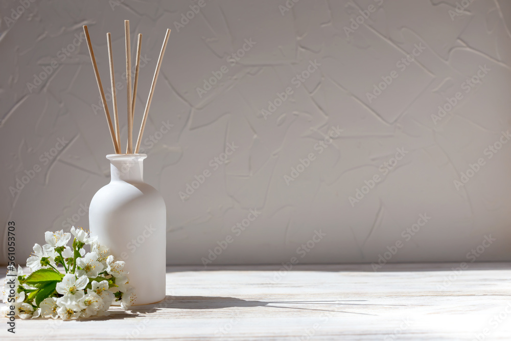 Aromatic reed diffuser and flowers - obrazy, fototapety, plakaty 