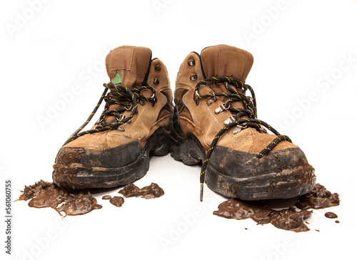 Workboots on white with mud photo