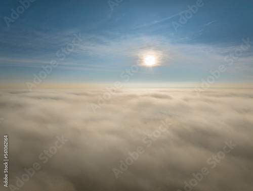 sun rising over a dense layer of fog covering northern Colorado, aerial view