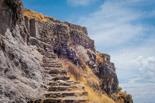 Escalera de piedra en Puka Pukara o Waqrapukara en los andes de Cusco.  photo