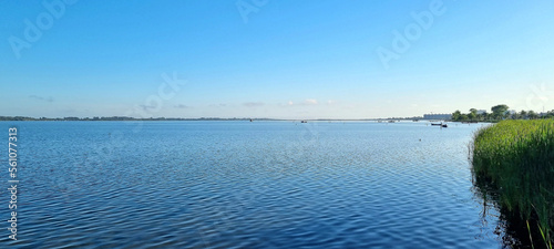 a beautiful sunny day at the lagoon, baquinhos illustrate the simple and simple life of the population, a pleasant place to observe the landscape and the city in the background