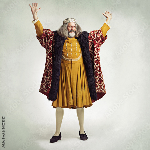 Royal king man, studio and hands in air for power, magic or winning celebration by gray background. Ancient medieval leader, portrait and full body with fantasy, happiness or vintage robe by backdrop