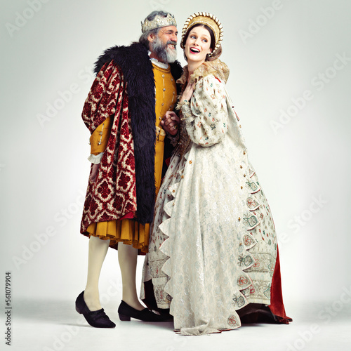 King, queen and love in medieval costume for royal party, retro carnival and theatre fashion clothes in white background. Couple, happy face and talking in vintage renaissance isolated in studio