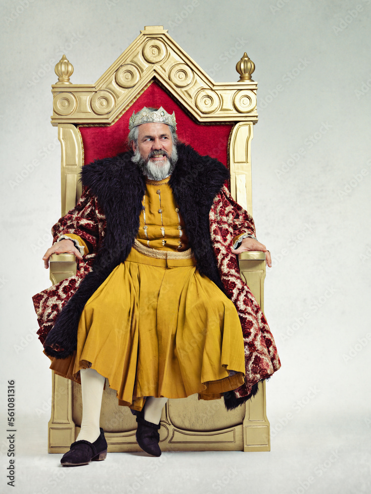 King, royalty and angry man on throne in studio isolated on a gray background mockup.Thinking, medieval and annoyed senior male, upset leader or frustrated ruler with crown sitting on golden seat.