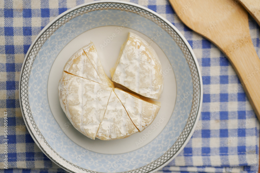 Camembert cheese on a bowl on table Camembert cheese on a bowl on table