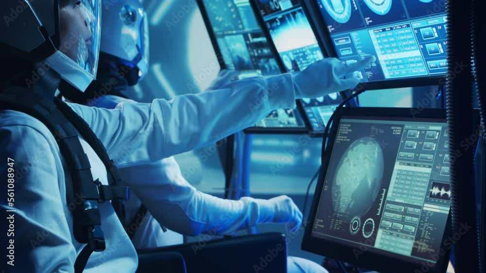 Team of astronauts in a space suits aboard the orbital station. A crew of cosmonauts piloting the spaceship. Man and woman in space. Galactic travel and science concept. Team of astronauts in a space suits aboard the orbital station. A crew of cosmonauts piloting the spaceship. Man and woman in space. Galactic travel and science concept.