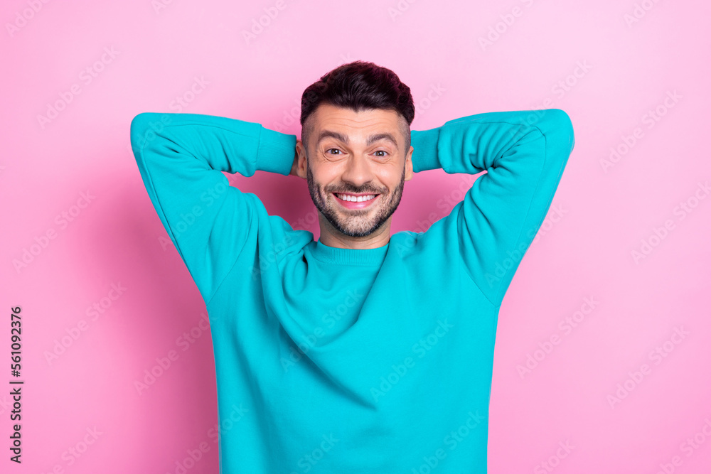 Photo of young positive wearing blue sweatshirt man chilling take nap pause break after hard work days hands head isolated on pink color background Photo of young positive wearing blue sweatshirt man chilling take nap pause break after hard work days hands head isolated on pink color background