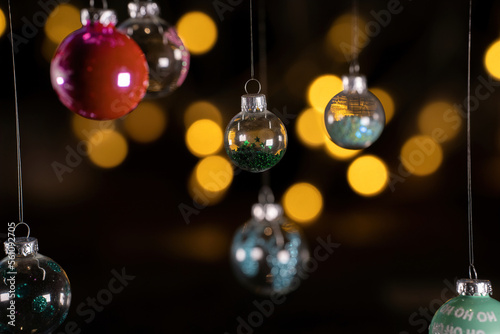 hanging colored Christmas balls with blurred background 